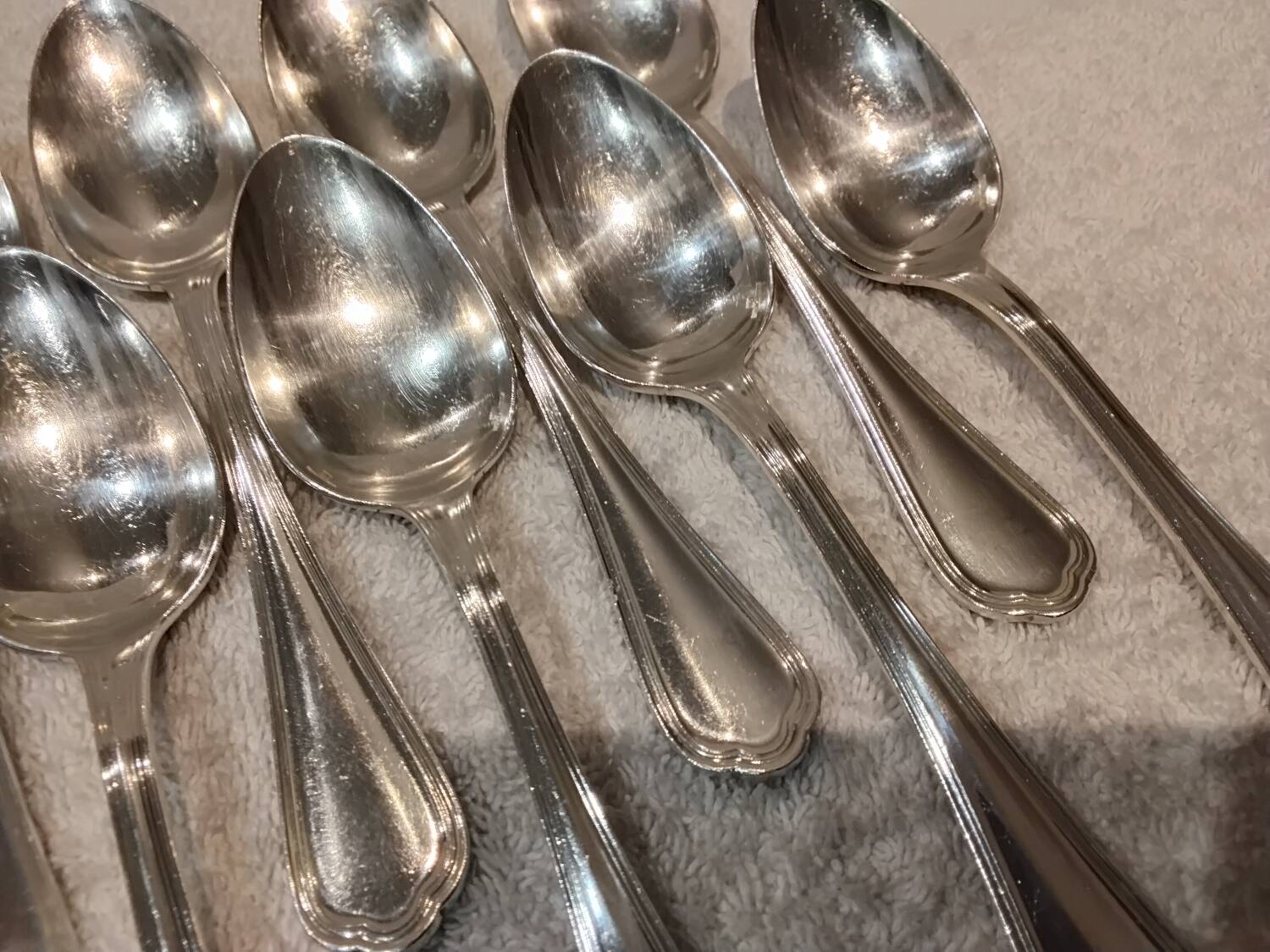 12 Christofle silver plated dessert spoons, 17cm