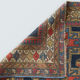 Handwoven blue ground persian rug with bird-like figures