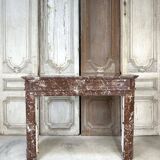 Red marble fireplace in the Louis XVI style, late 19th century