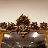 Antique English golden barock mirror mirror with large ornament