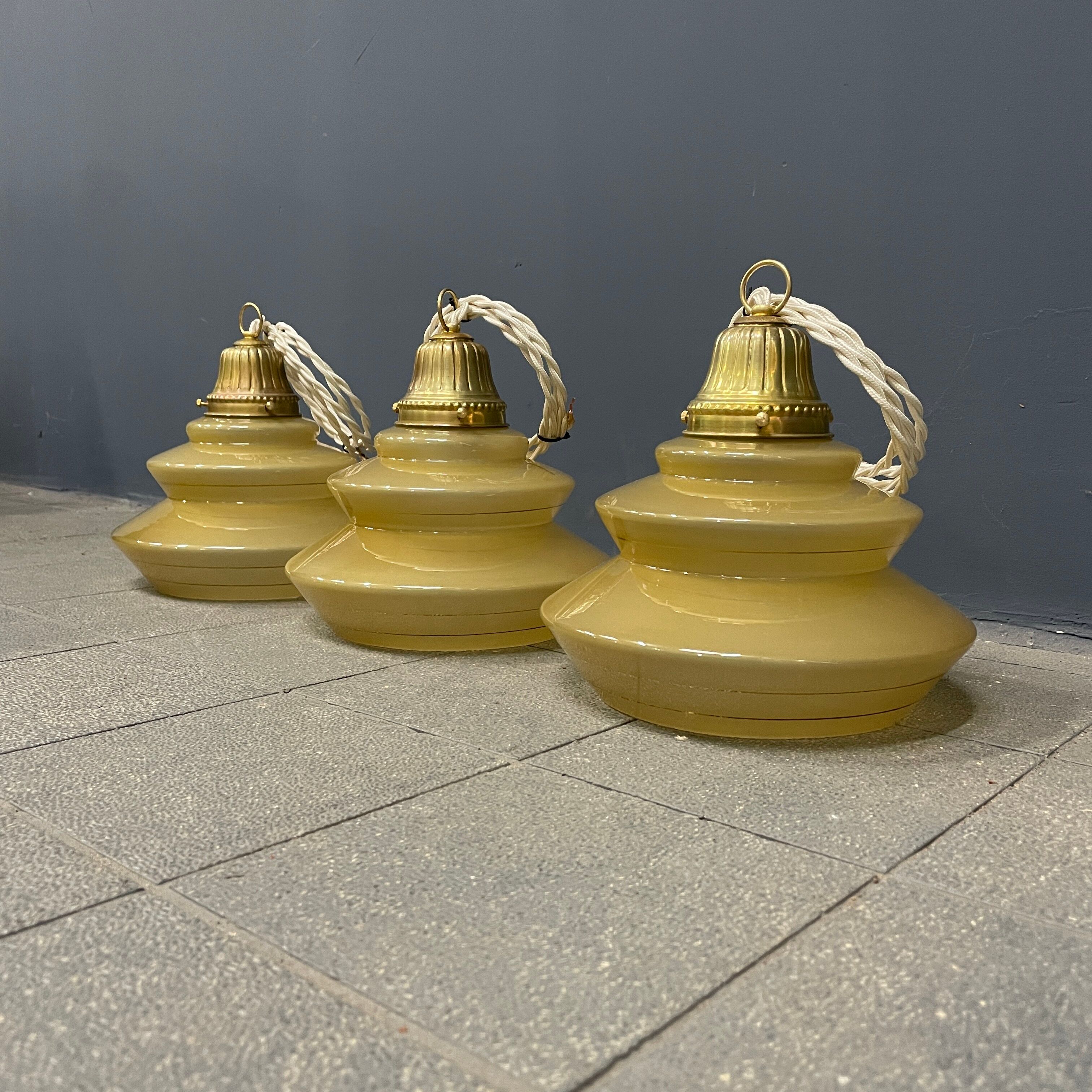 Vintage ocher glass hanging lamps with brass gallery