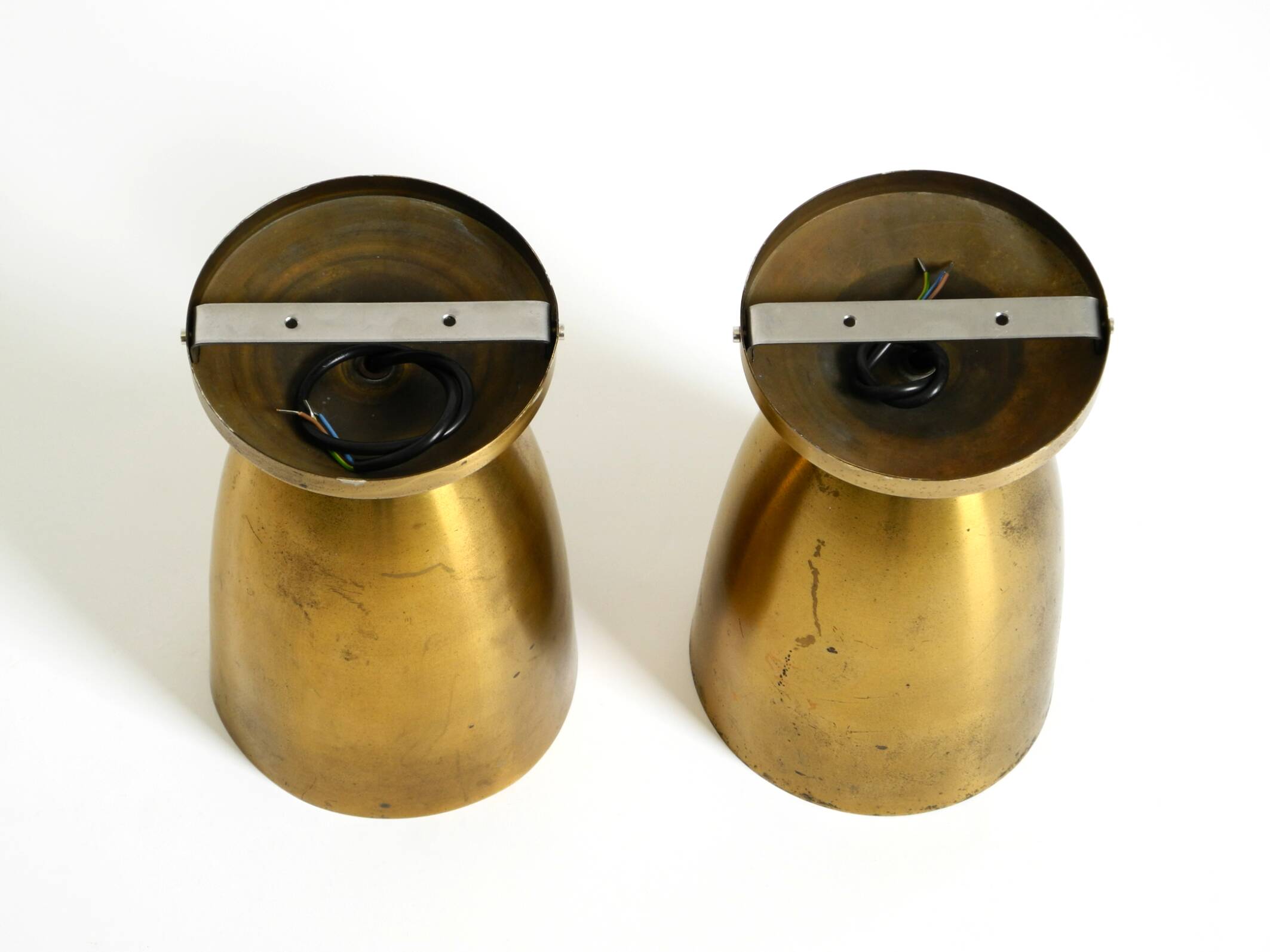 A pair of large, original Mid Century Modern brass ceiling lamps