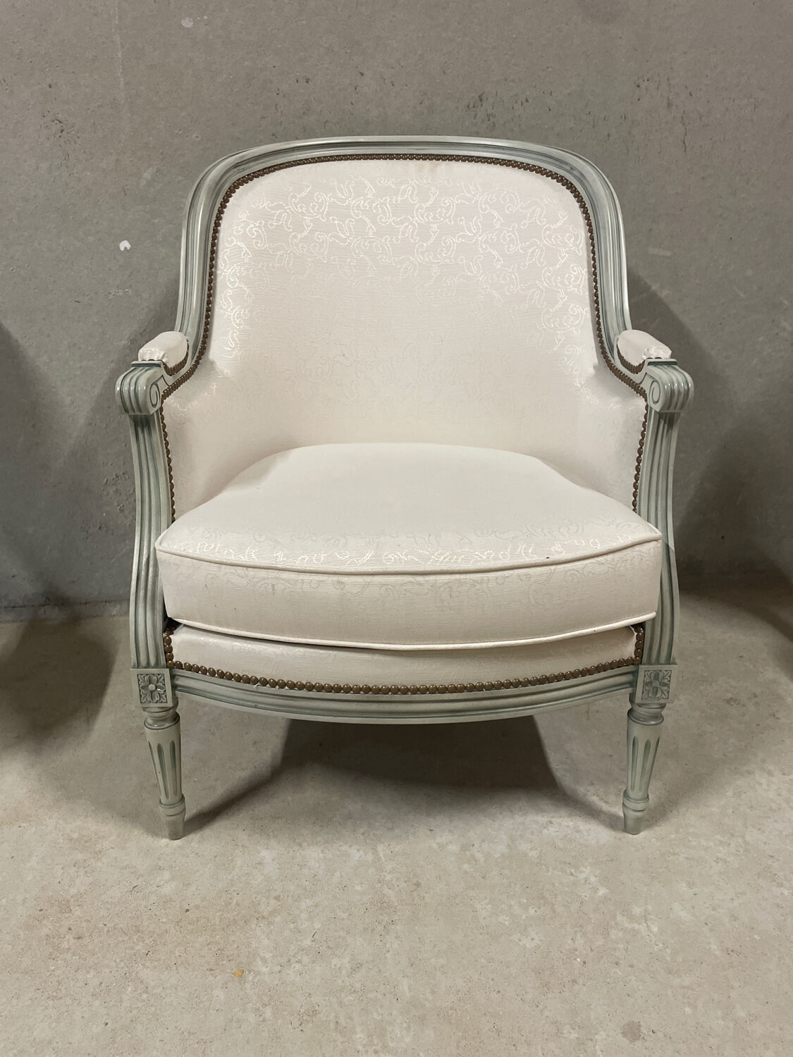 Armchair and 2 chairs set in Louis XVI style, light fabric, patinated wood.