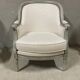 Armchair and 2 chairs set in Louis XVI style, light fabric, patinated wood.