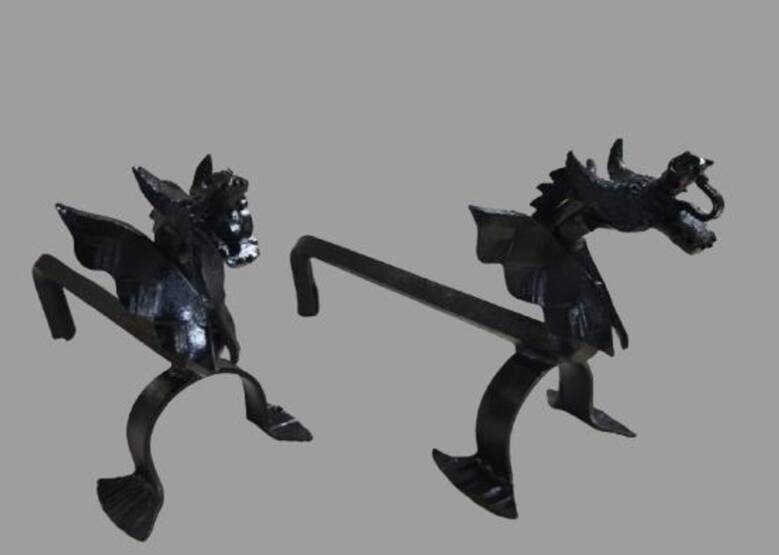 A pair of wrought iron andirons with dragon heads, 1970s.