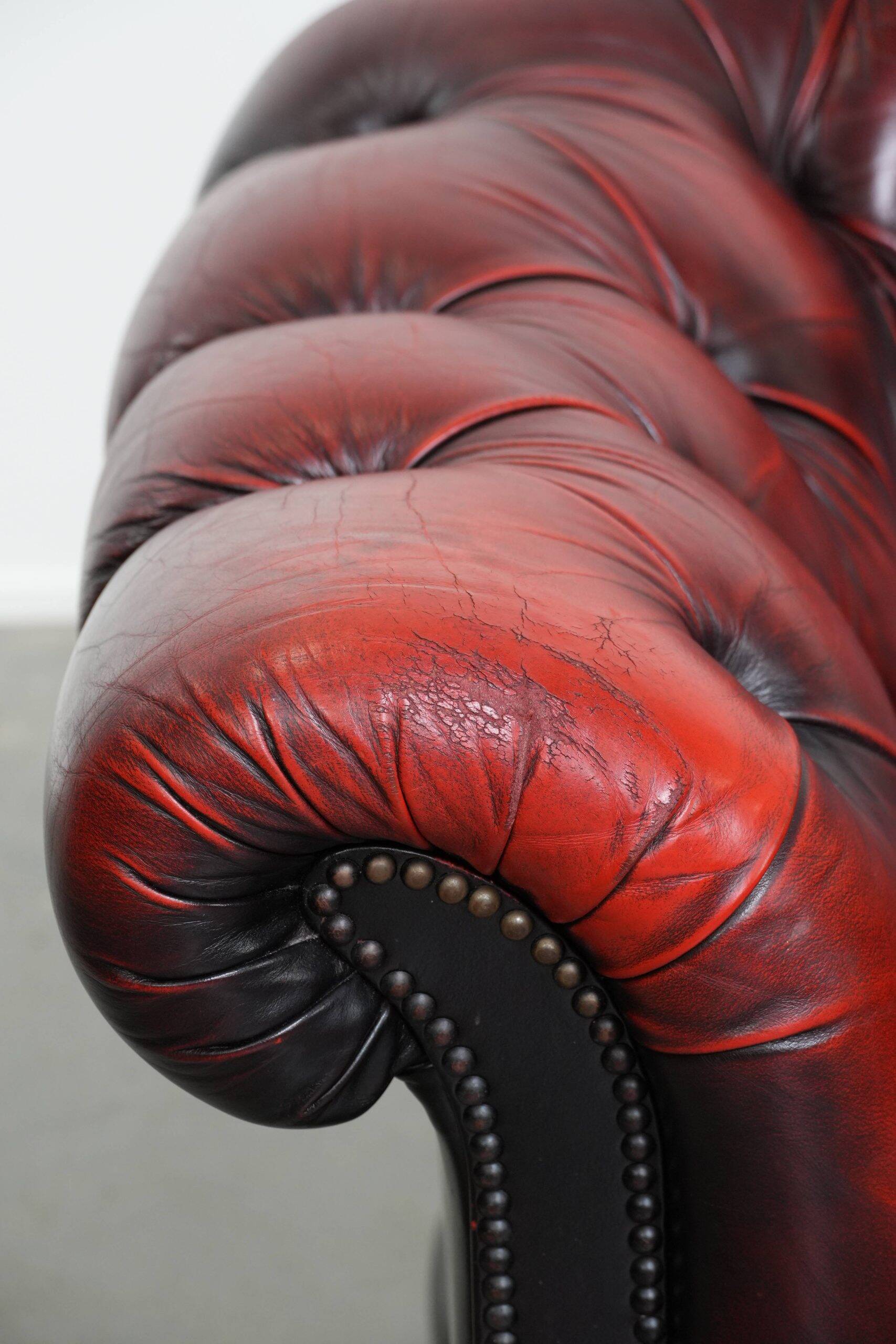 Classic cowhide Chesterfield button seat armchair in a beautiful red colour