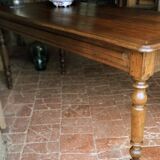 Old French farmhouse table in walnut with turned legs.
