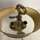 A pair of old brass bed warmers.