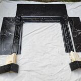 Pompadour fireplace with black marble modillions