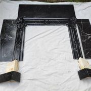 Pompadour fireplace with black marble modillions