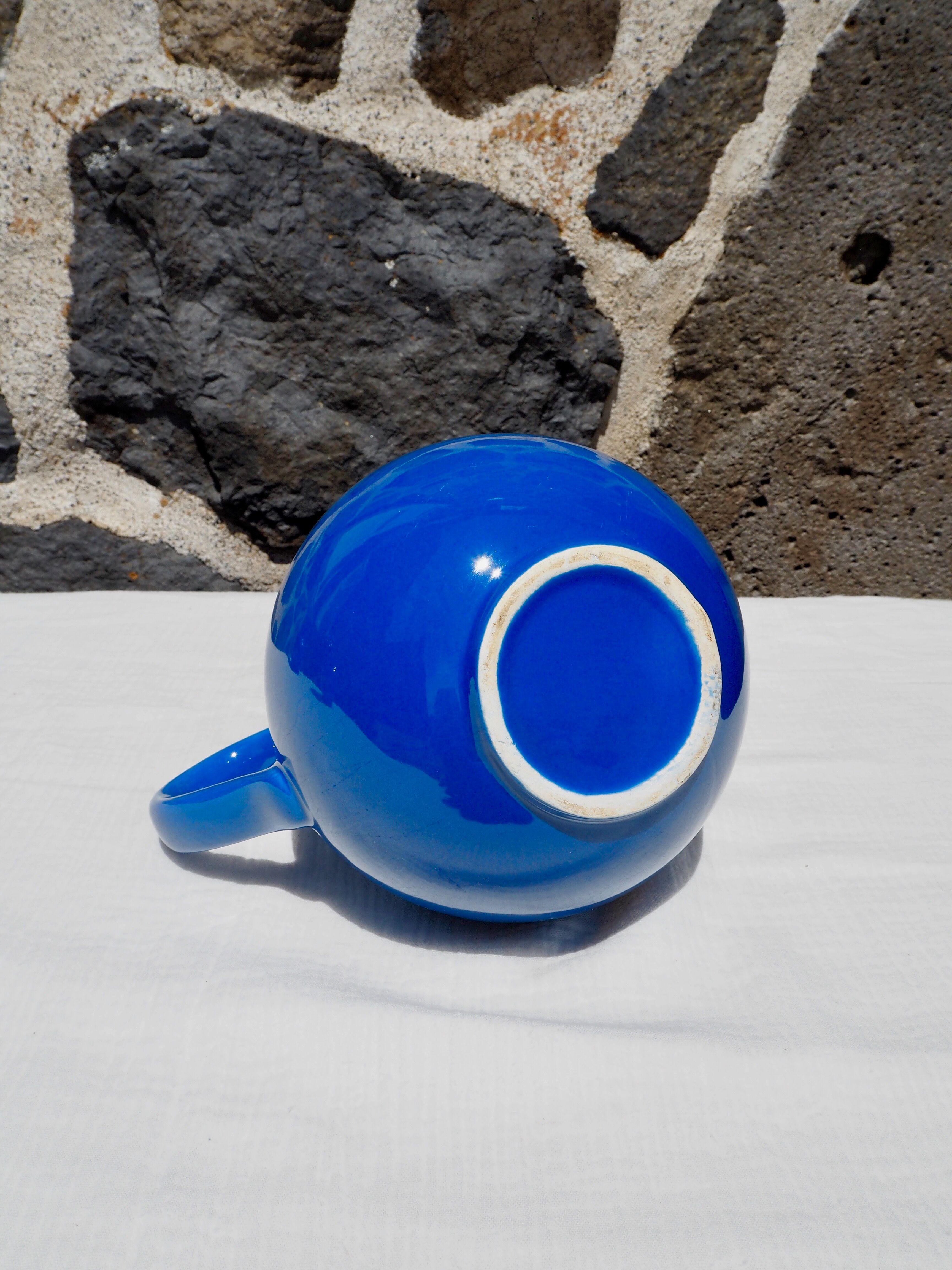 Blue ceramic belly pitcher