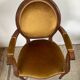 Paire de fauteuils médaillon en bois et velours