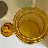 Old apothecary jar in blown amber glass