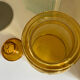 Old apothecary jar in blown amber glass