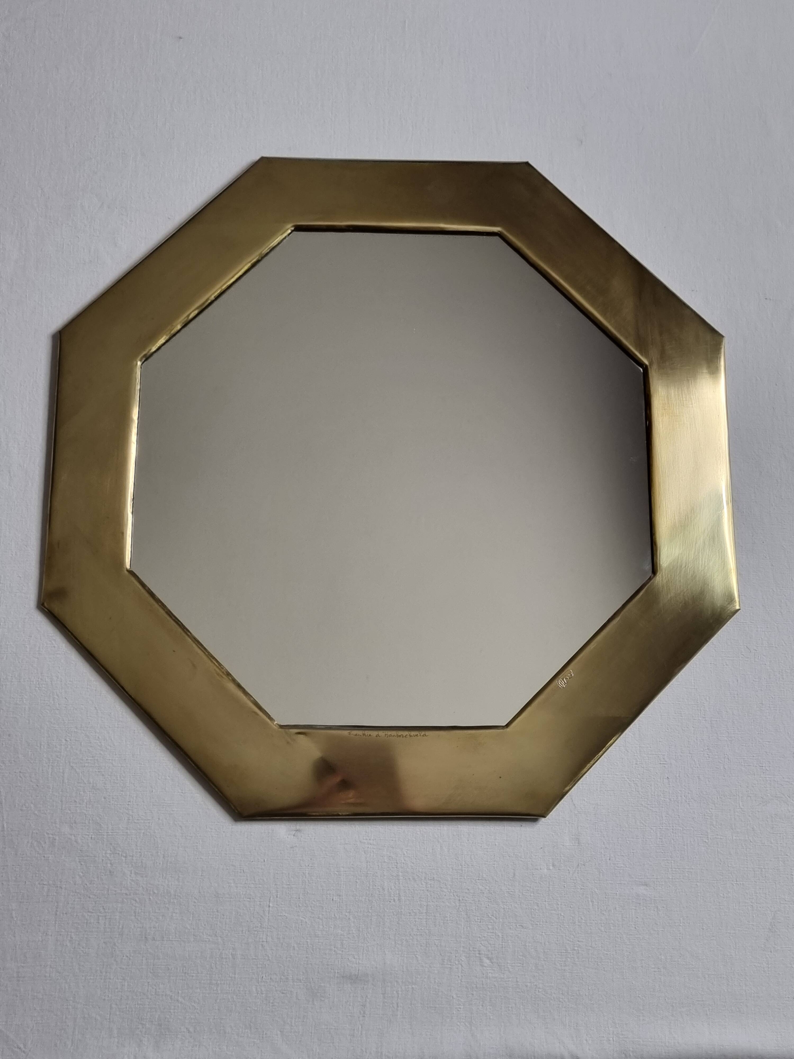 Octagonal brass mirror signed Frankie d'Homborchveld, 47 x 50 cm