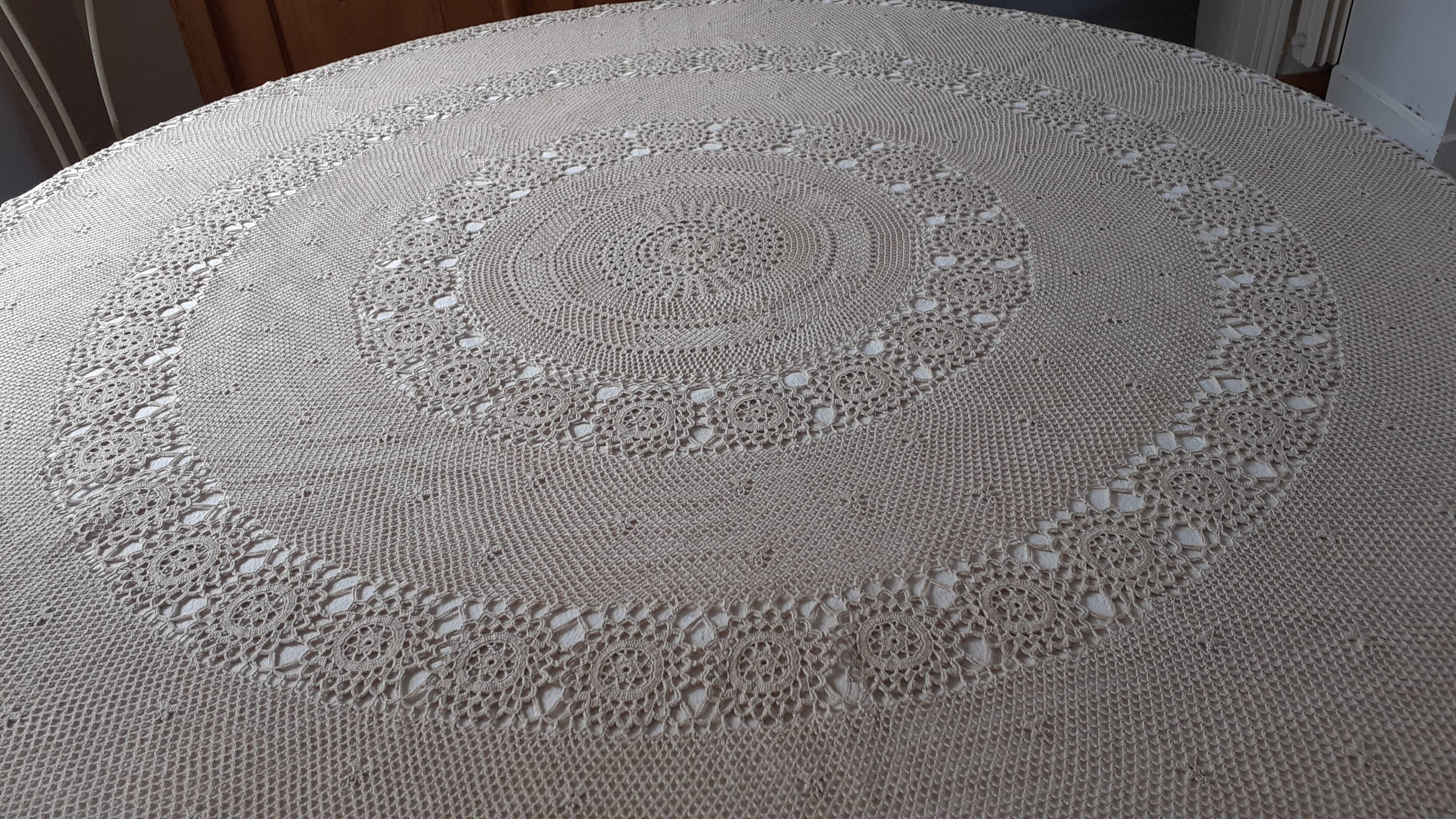 Old crochet round tablecloth with matching napkins