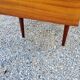 60s desk in golden blond mahogany with conical coffered feet