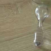 Glass carafe with enamel decoration of cherries.
