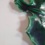 empty green ceramic pocket cup, small chips on the edges, signed