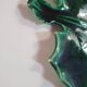 empty green ceramic pocket cup, small chips on the edges, signed