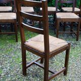 Suite of 17 straw chairs with high backs