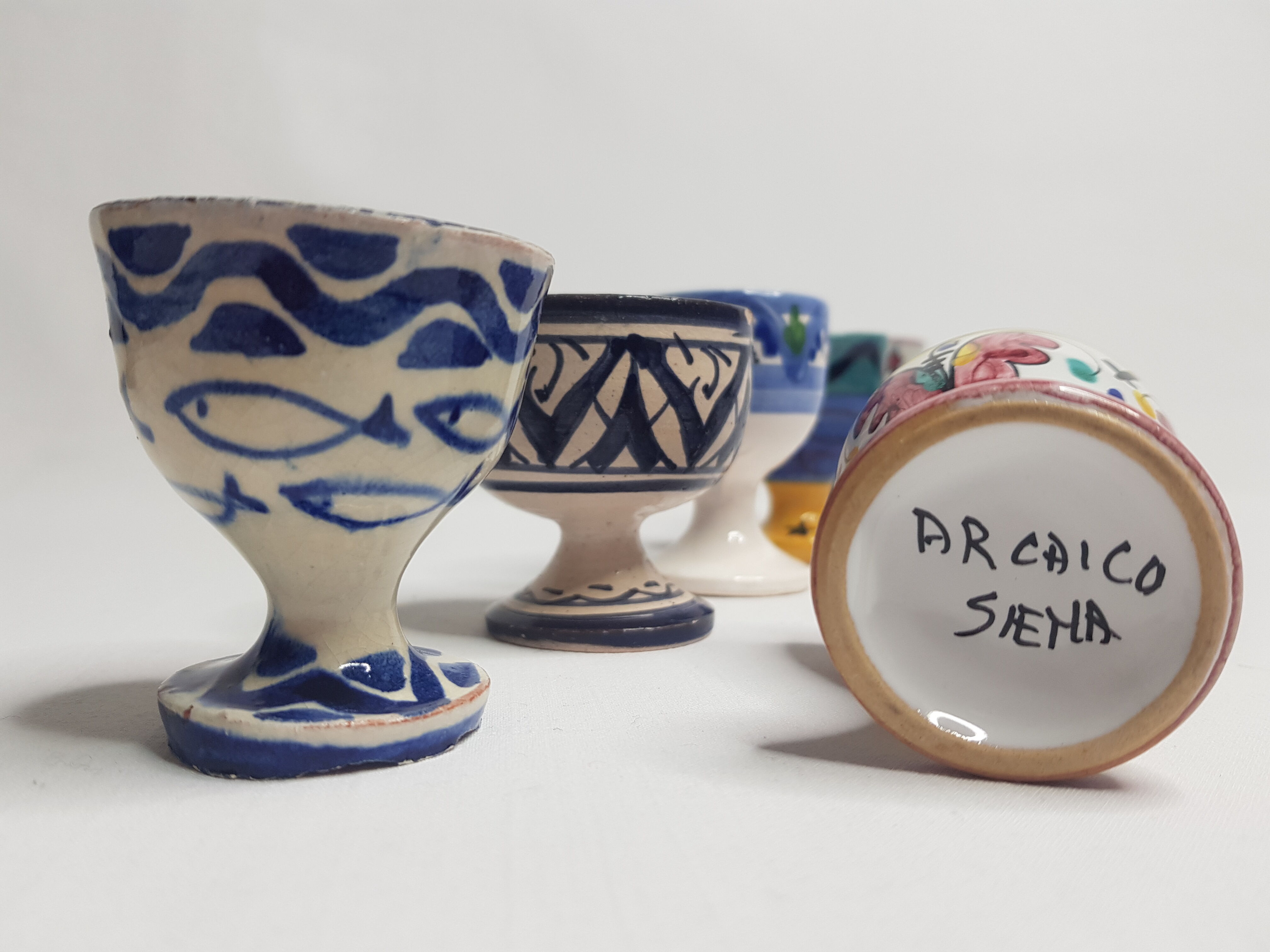 Lot of six enamelled ceramic cockroaches with Mediterranean themed decorations