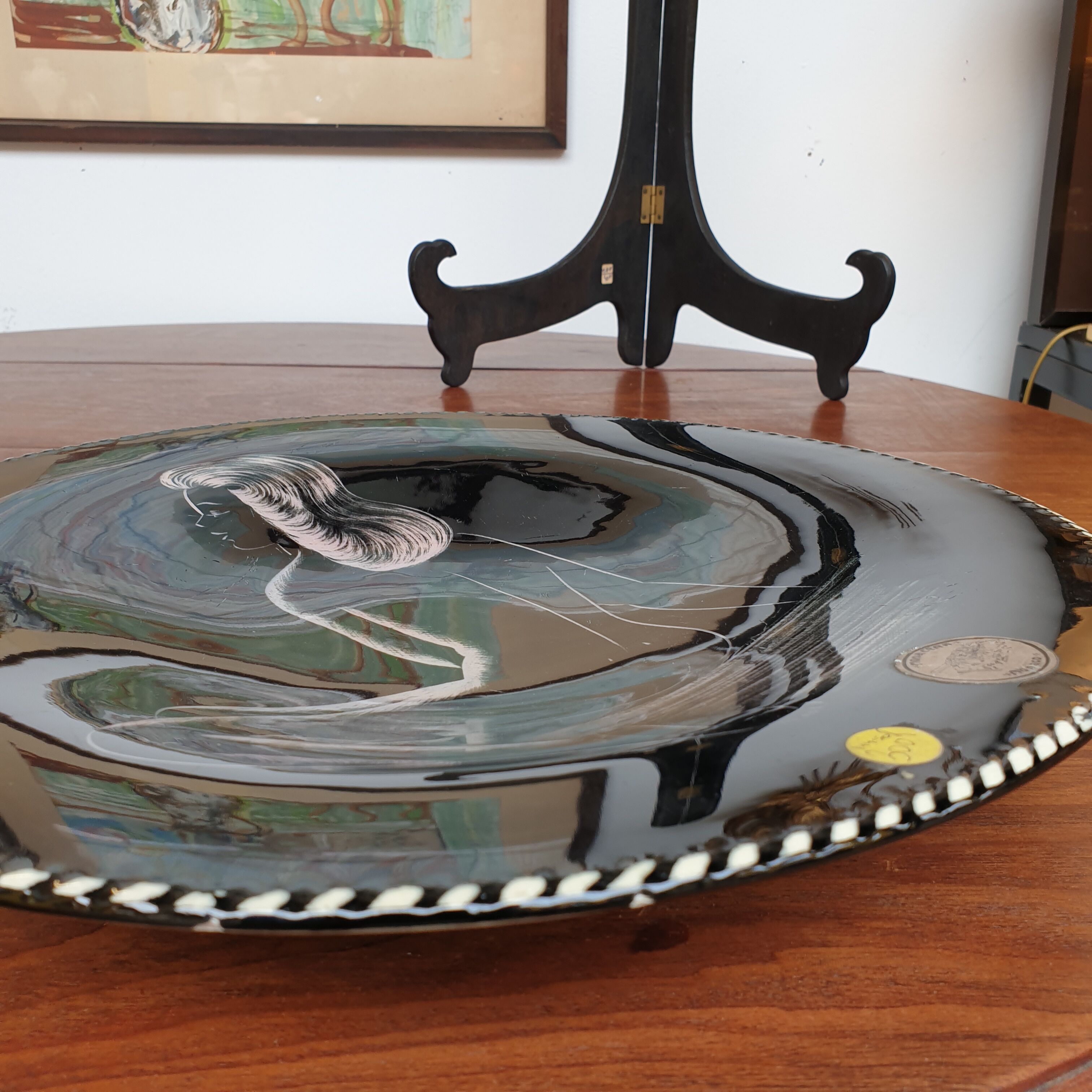 Ceramic dish nu feminine on black background