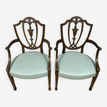 According to George Hepplewhite: pair of 19th century mahogany office armchairs