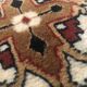 Wool carpet with oriental decoration on a brown background