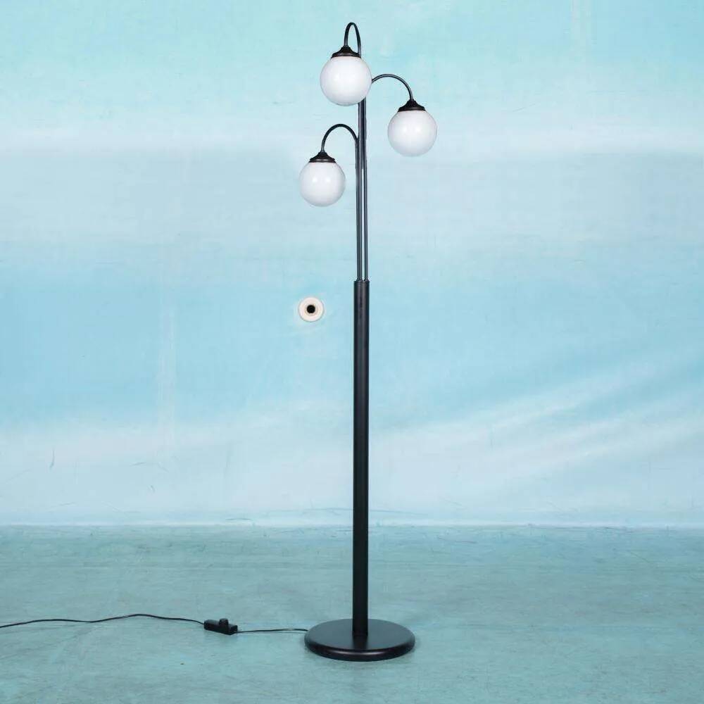 Minimalist floor lamp in glass, space age style.