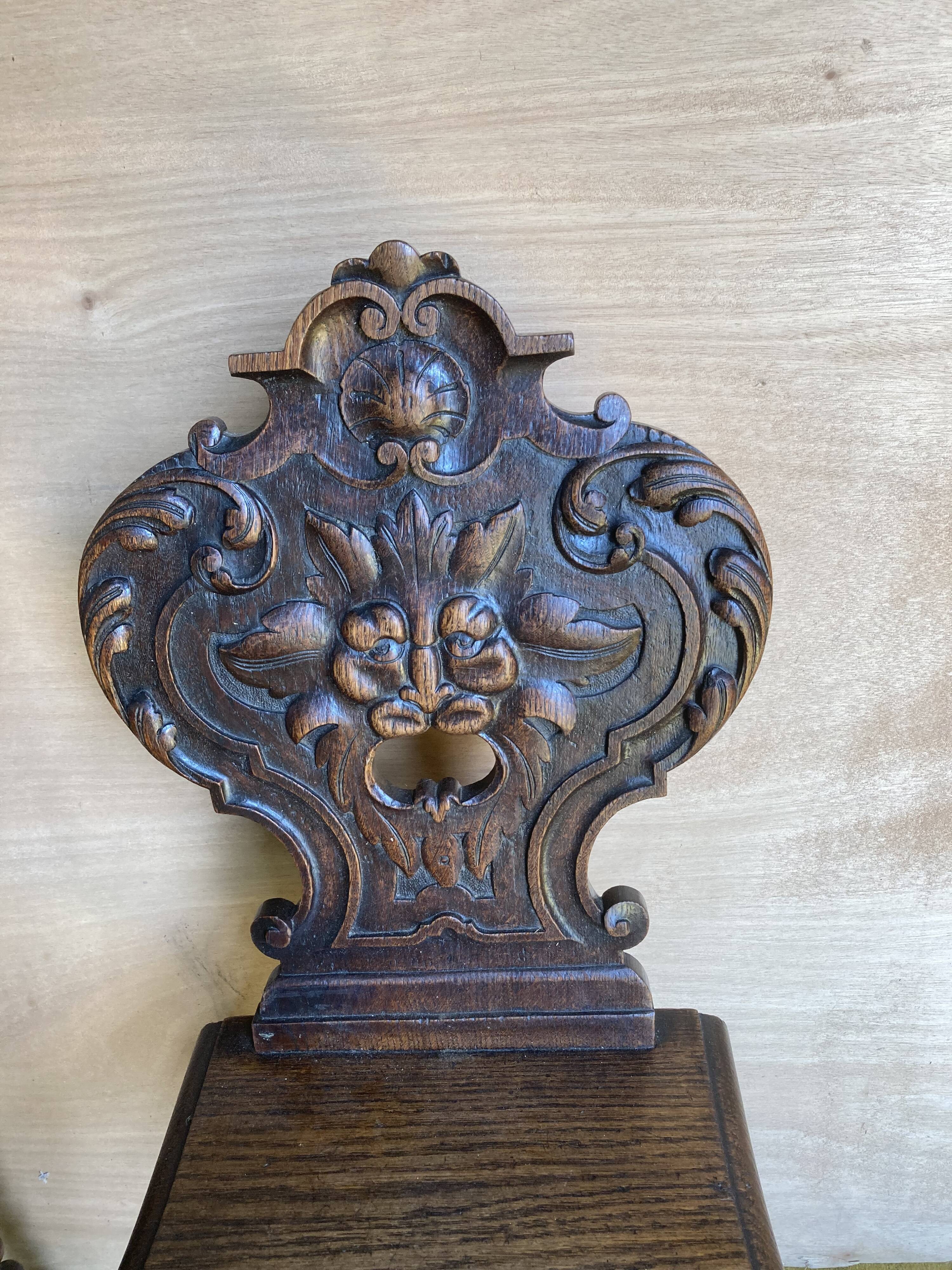 Duo of carved wooden chairs