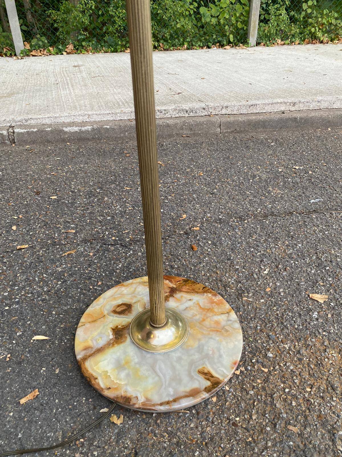 Vintage brass onyx floor lamp with fringed shade.
