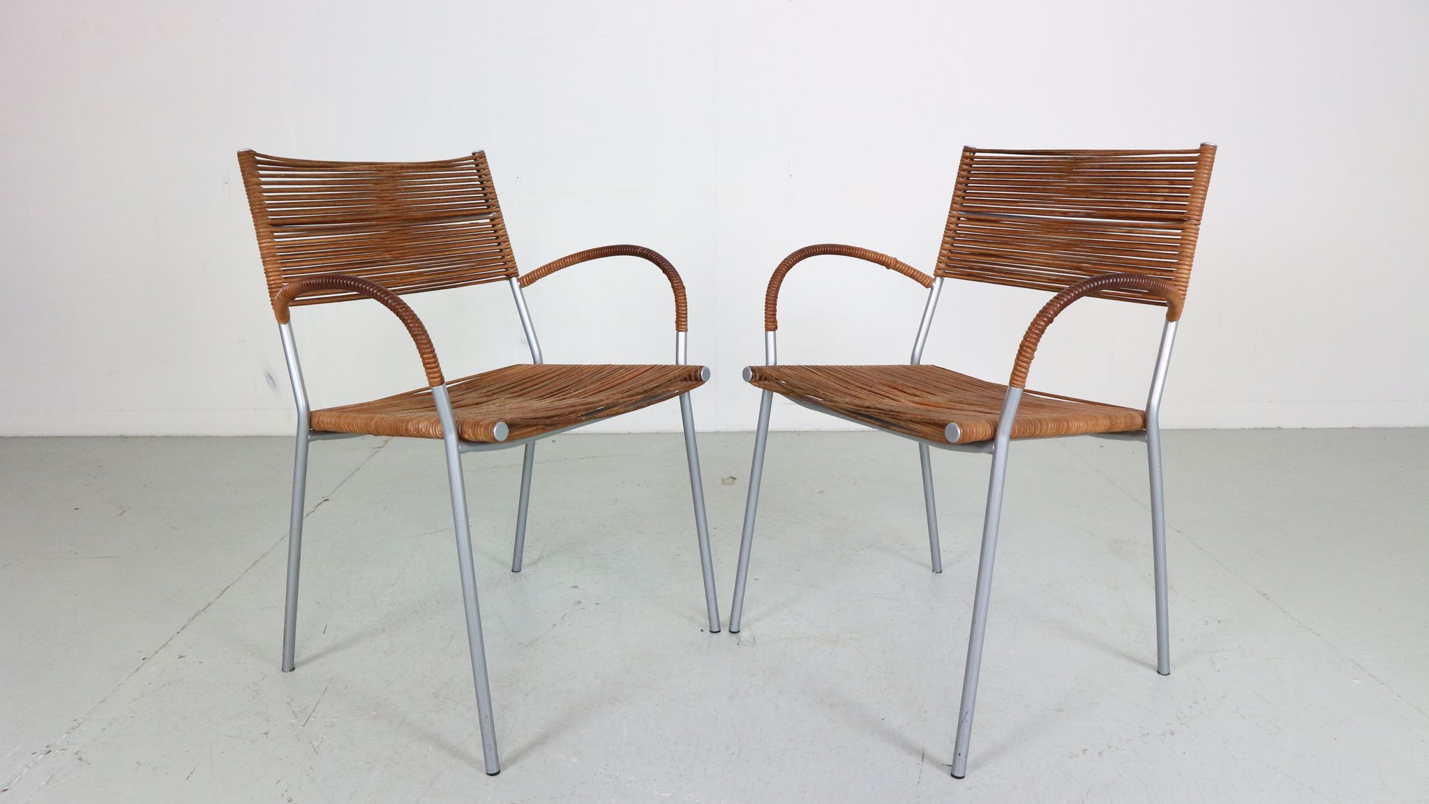 Set of 2 leather Mis B2 RVS armchairs by Tito Agnoli  for Pierantonio Bonacina