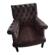 Buttoned armchair