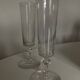 Pair of crystal champagne flutes with a button foot, 1960.