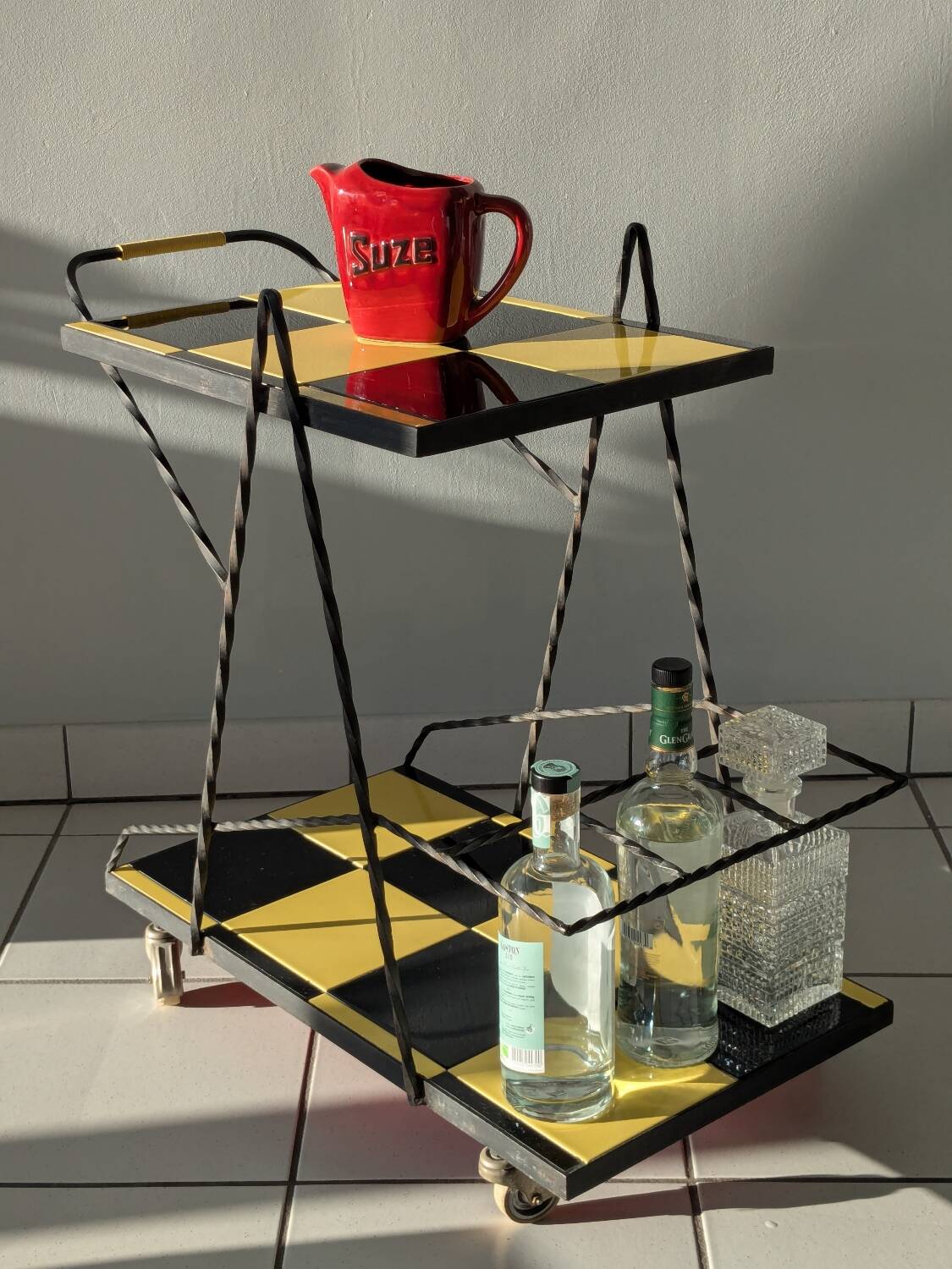 Vintage black and yellow checkered rolling bar trolley