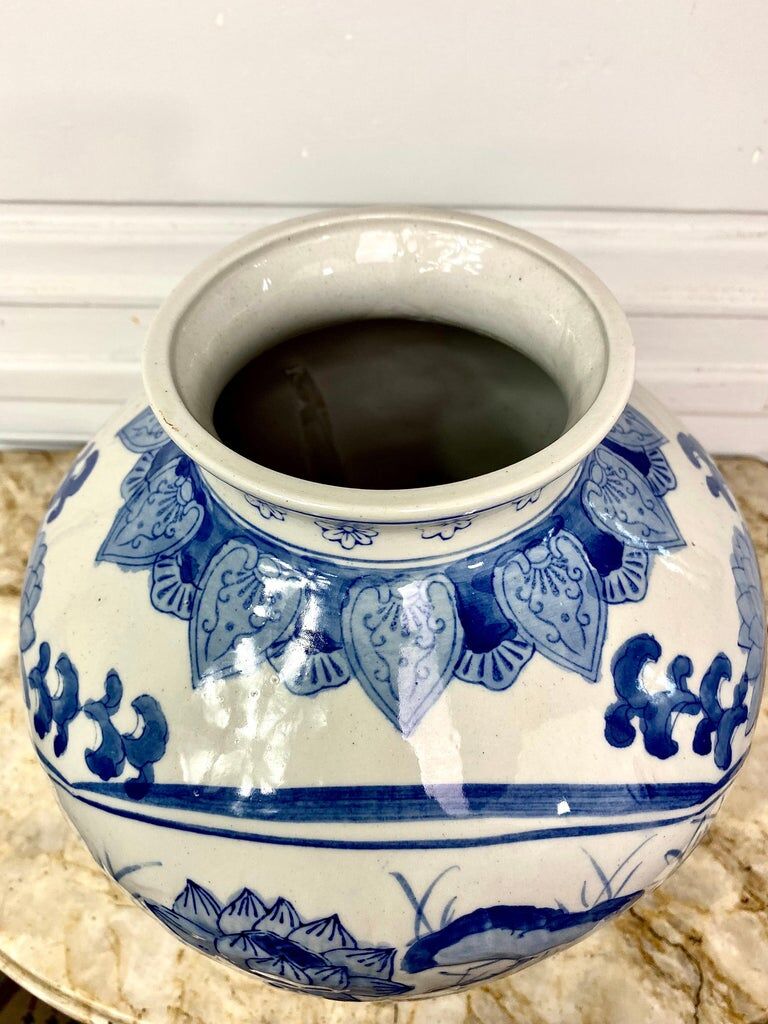 Chinese vase in blue-white porcelain decorated with lotus flowers