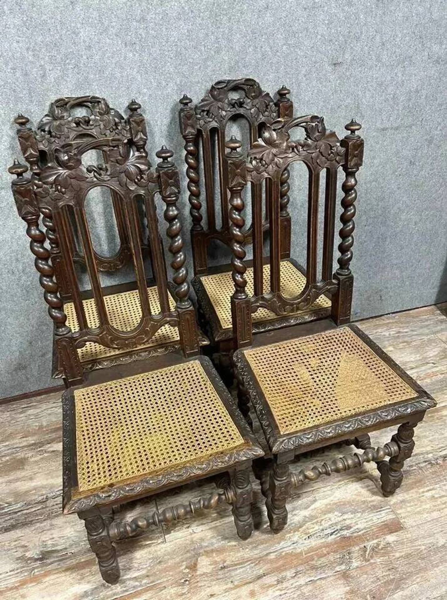 Set of 4 Renaissance style hunting lodge chairs in carved oak