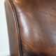 Characterful vintage sheepskin leather armchair with beautiful colours