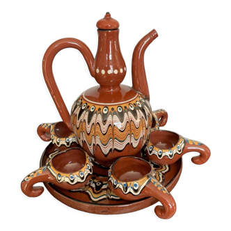 Vintage liqueur service in glazed terracotta