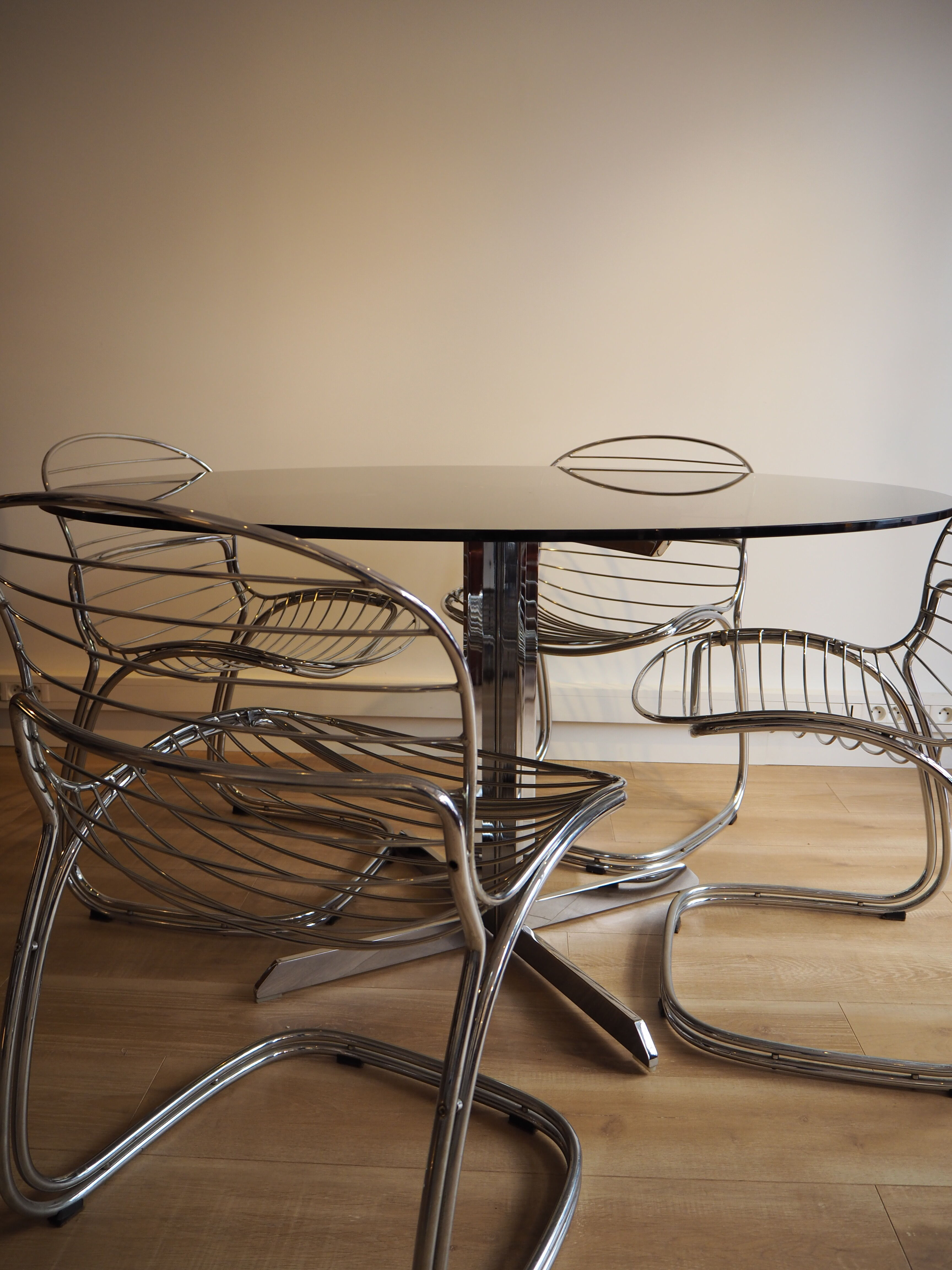 Smoked glass round dining table