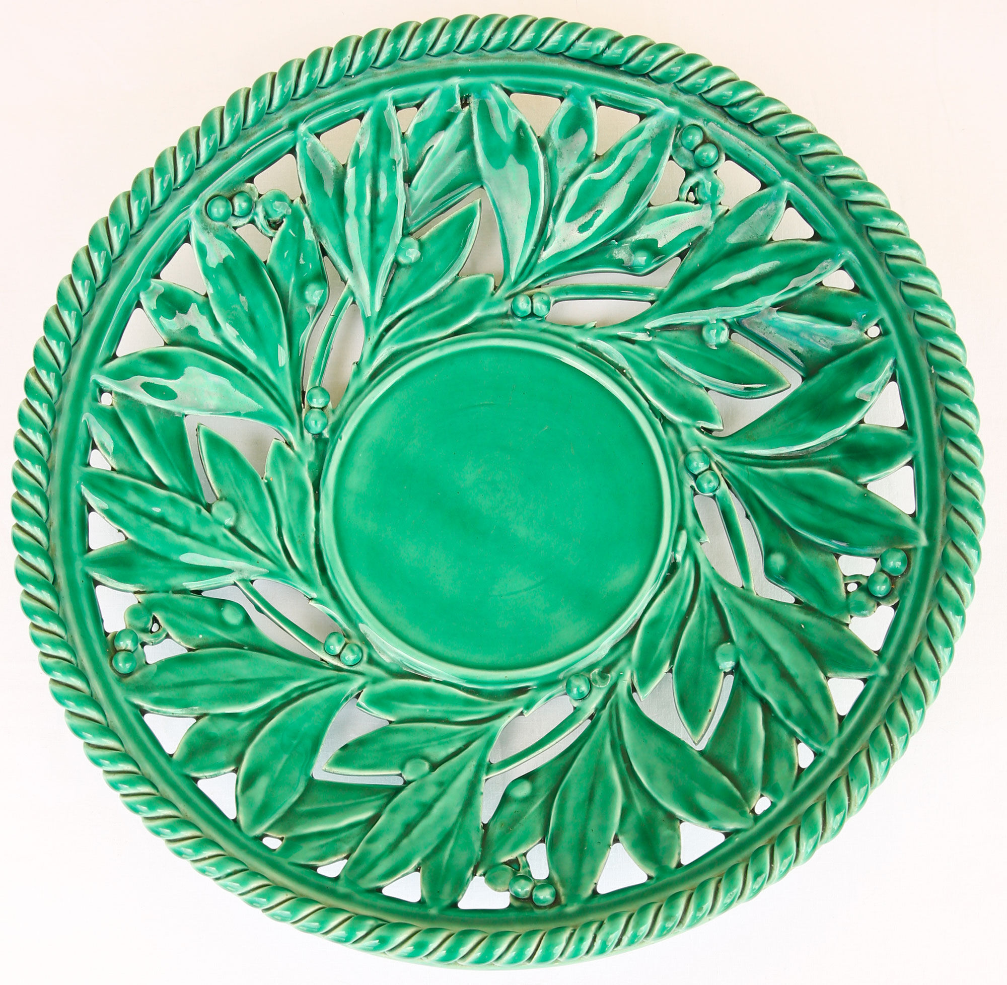 Openwork XL dish in green slurry like olive branches