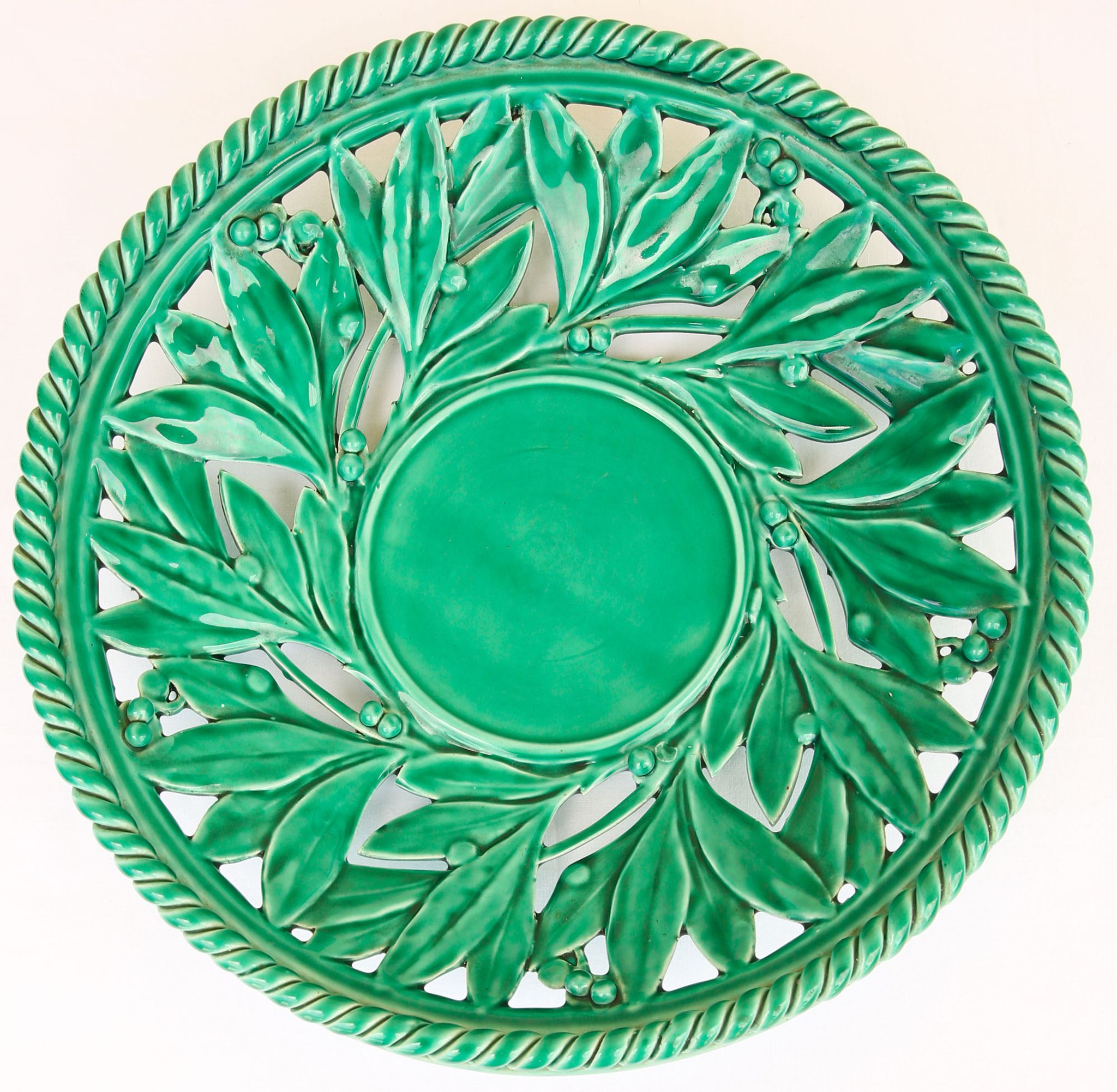 Openwork XL dish in green slurry like olive branches