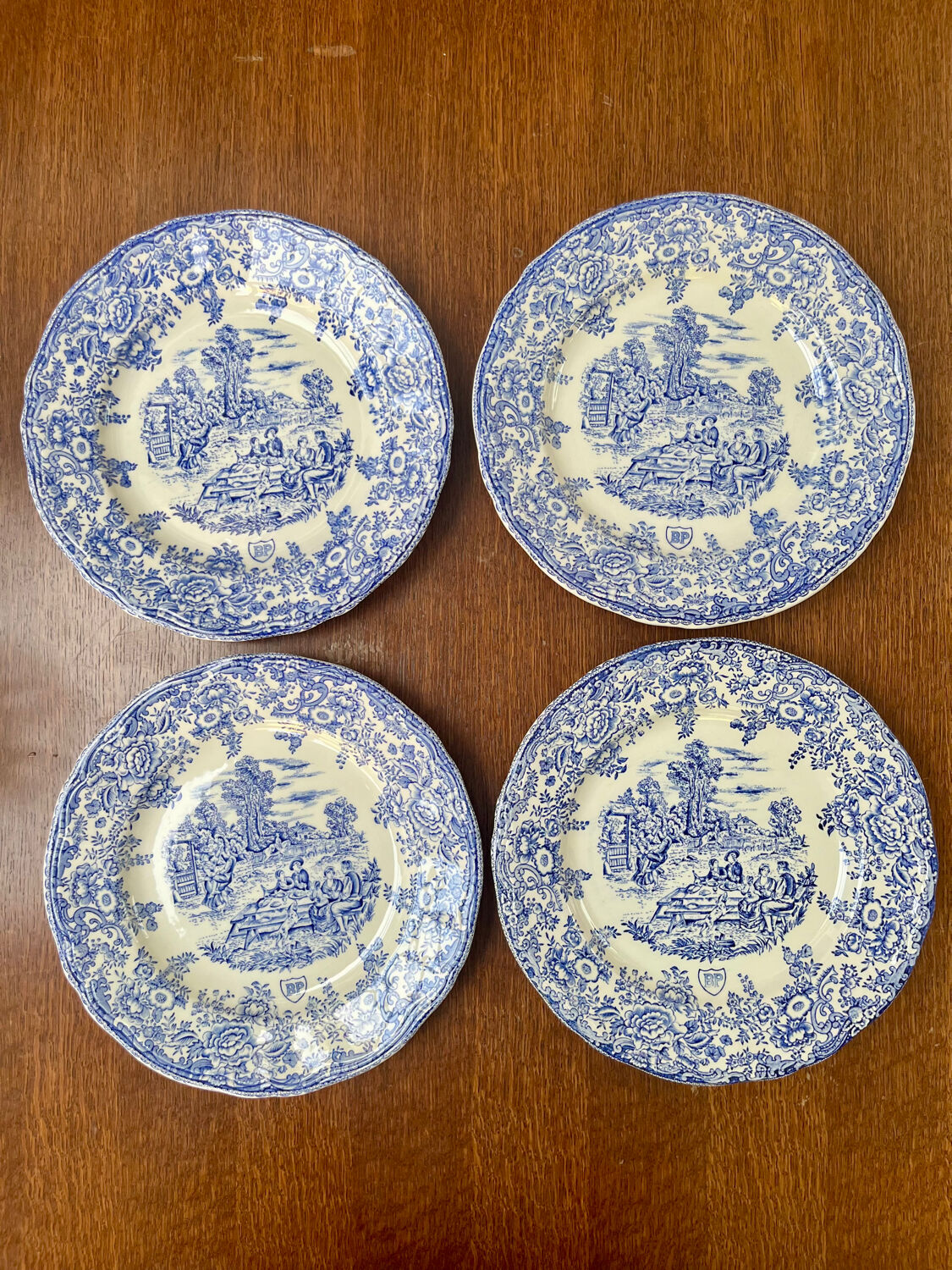 Set of 4 vintage BP blue plates – earthenware decorated with a rural scene