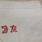 AC monogrammed linen campaign sheet at cross point