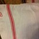 Former flax torchon cushion red stripes monogram b