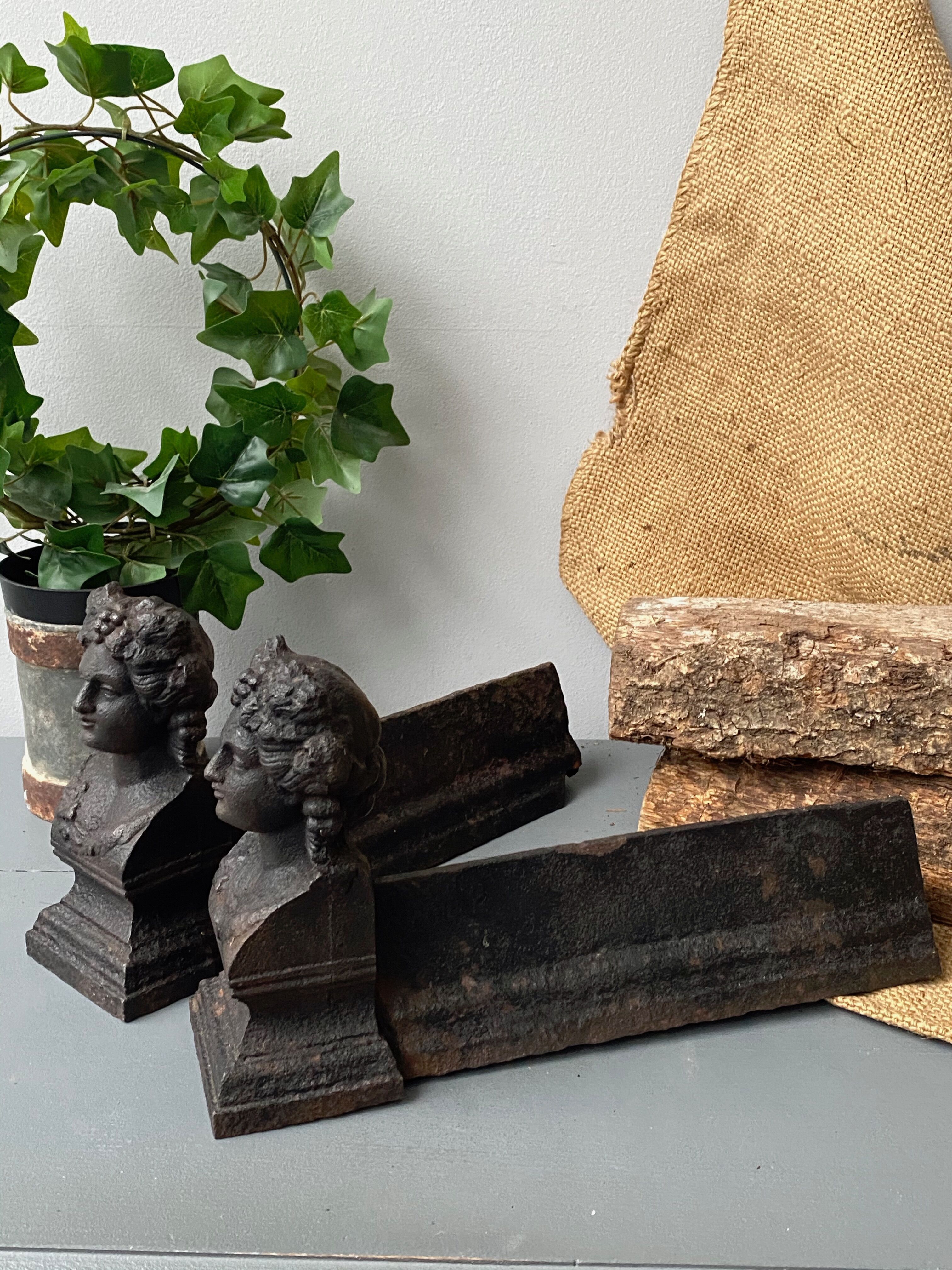 Pair of cast iron pegs