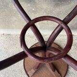 Pedestal table in curved wood