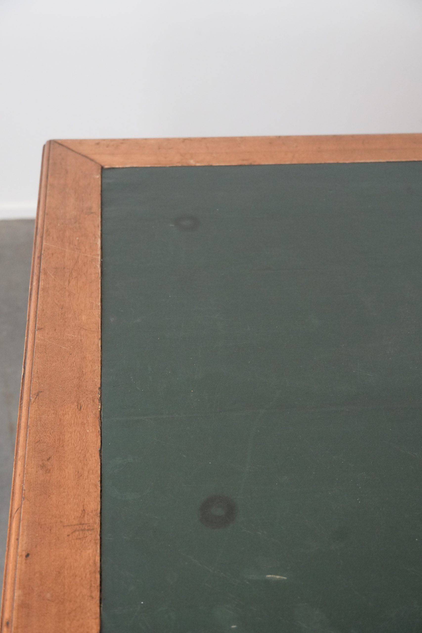 Antique writing table / partner desk with 4 drawers and a green leather top