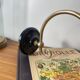 Swan neck wall light in brass with glass tulip.
